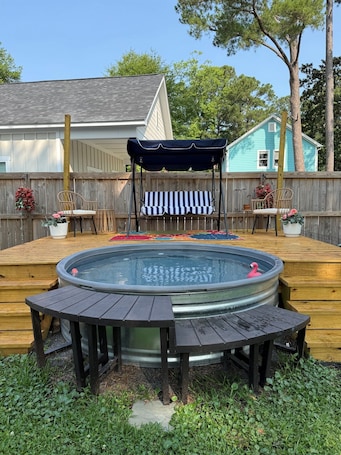 Outdoor spa tub. The Salty Peach, A Sweet Retreat