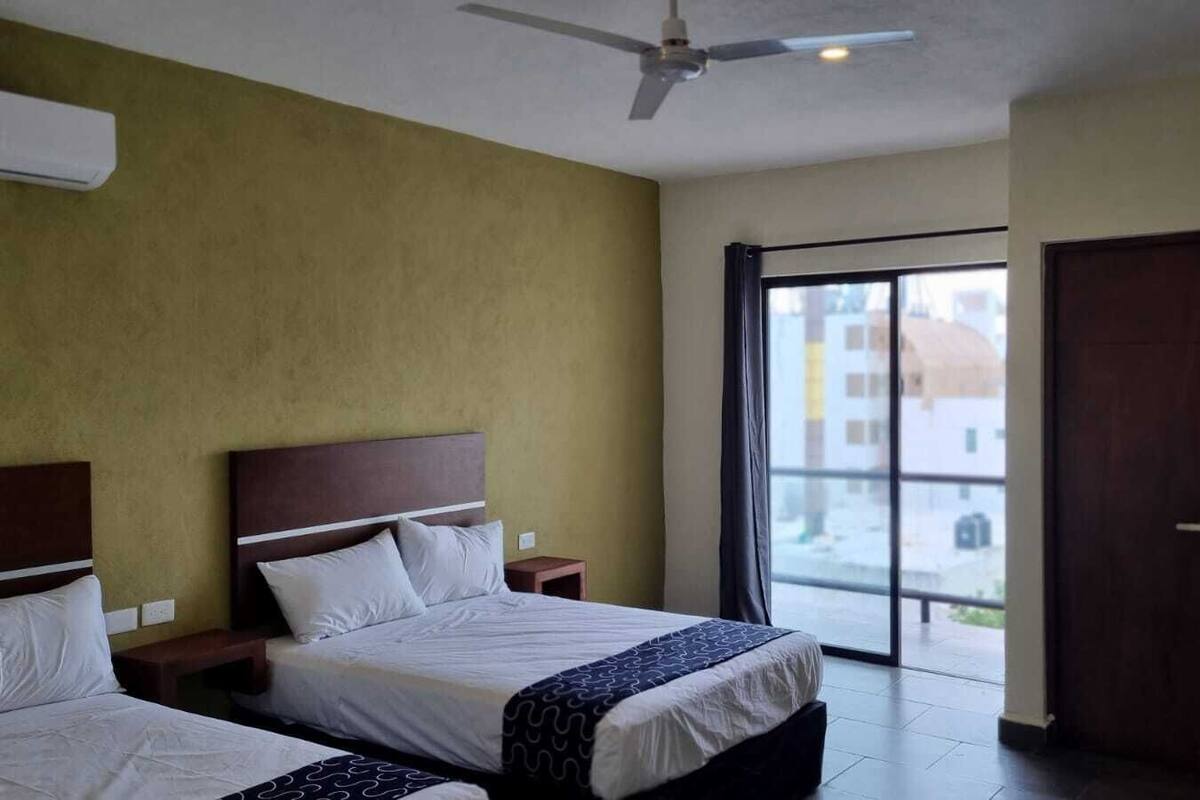 Deluxe Quadruple Room, 1 Bedroom, Partial Sea View | Hypo-allergenic bedding available, WiFi (free), bed sheets
