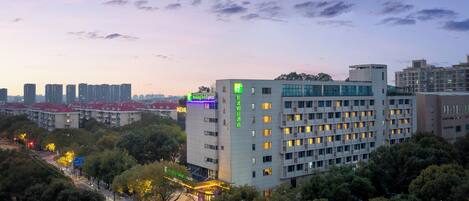 A multi-story hotel with a modern design, featuring a prominent Holiday Inn Express sign.