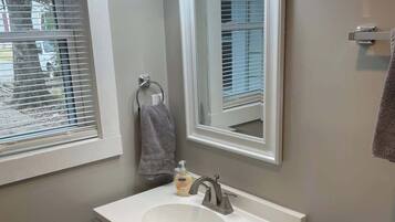 Shower, hair dryer, towels, shampoo