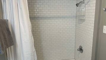 Shower, hair dryer, towels, shampoo