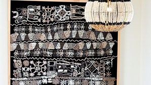 A dining area with a black table and four upholstered chairs, a black and white patterned artwork on the wall, and a hanging chandelier. - Dos Hermanas 4, 5, 6 & 8| Walk to Plaza| Courtyard (Santa Fe)