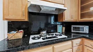 Fridge, microwave, stovetop, coffee/tea maker