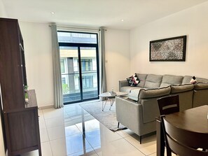 Luxury Apartment, 1 Bedroom | Living area | 65-inch Smart TV with digital channels, Netflix, streaming services - Embassy Gardens Apartment (Accra)