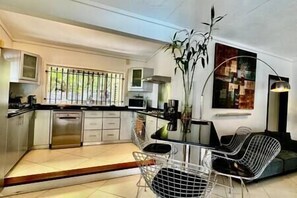 Enjoy meals in the kitchen with a central island and dining area.