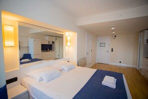 Apartment | Living area | 22-inch Smart TV with digital channels - Orbi City NickManagement (Batumi)