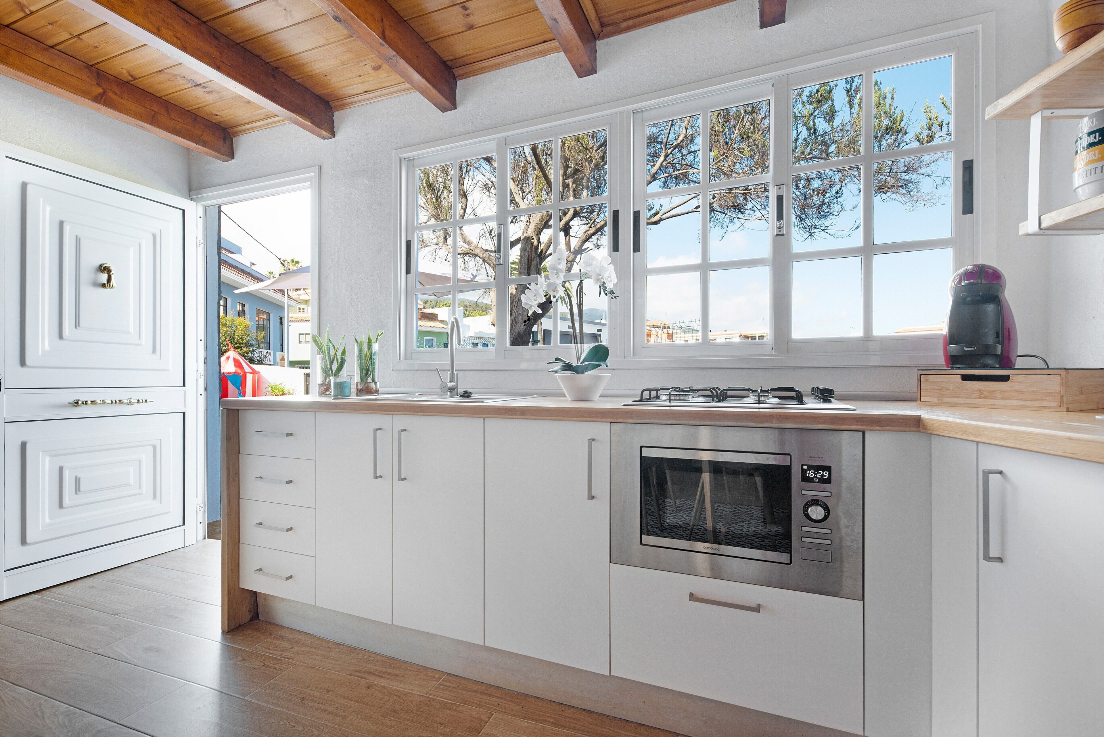 Fridge, microwave, stovetop, coffee/tea maker