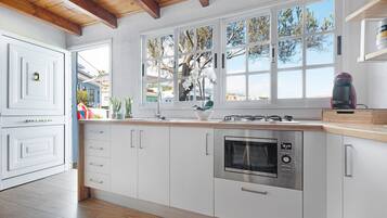 Fridge, microwave, stovetop, coffee/tea maker