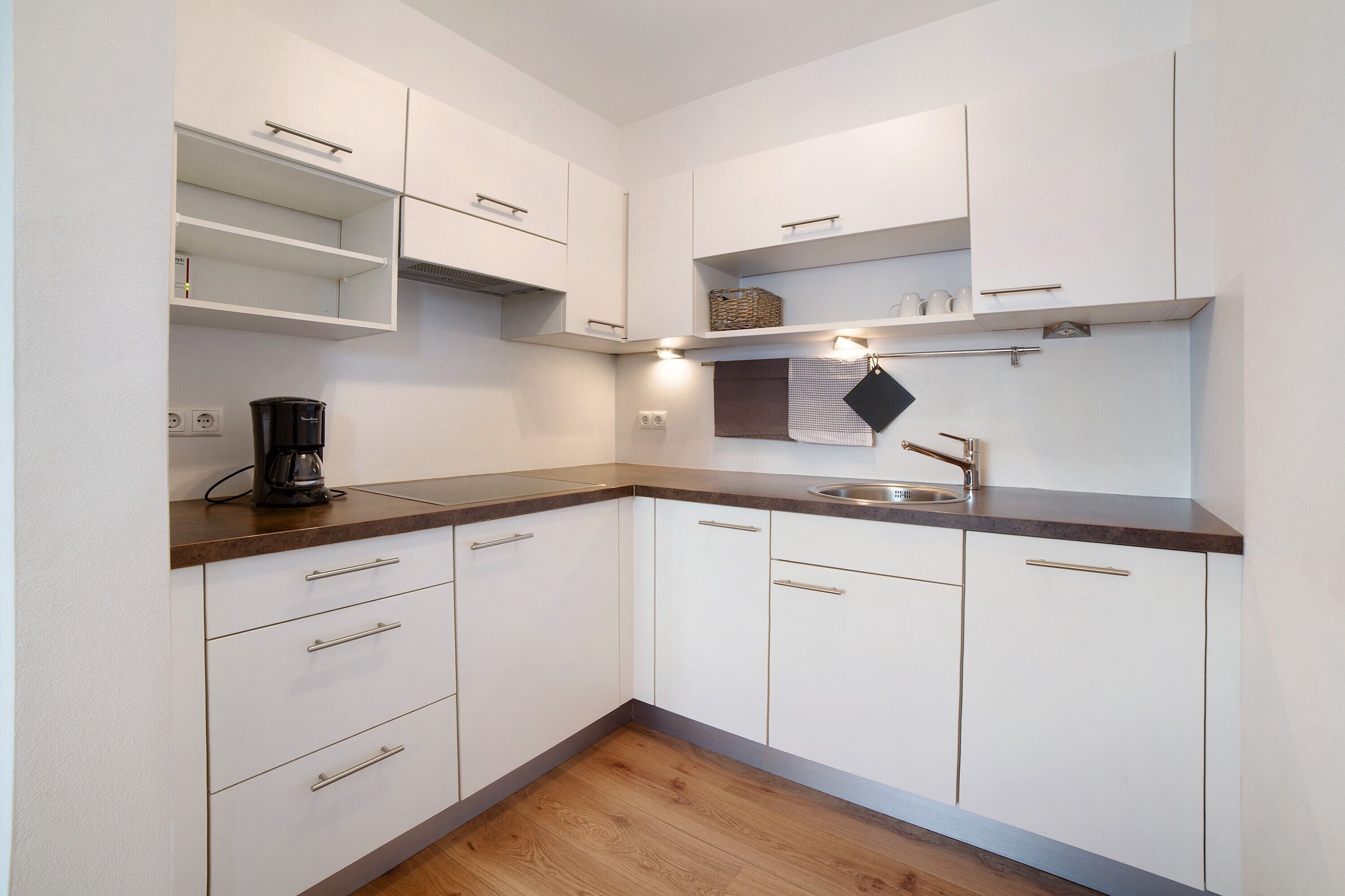 Fridge, stovetop, dishwasher, coffee/tea maker