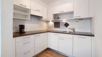 Fridge, stovetop, dishwasher, coffee/tea maker