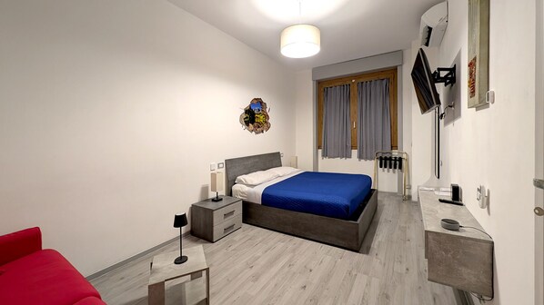 1 bedroom, desk, iron/ironing board, travel crib