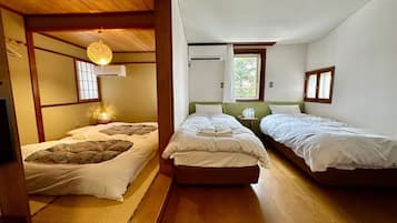 Deluxe Quadruple Room, Multiple Beds, Non Smoking | 1 bedroom, down duvets, desk, laptop workspace