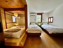 Deluxe Quadruple Room, Multiple Beds, Non Smoking | Down comforters, desk, laptop workspace, free WiFi