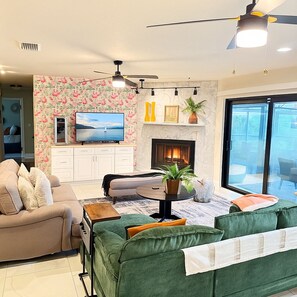 Smart TV, fireplace, table football, books