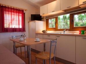 Fridge, cookware/dishes/utensils, dining tables