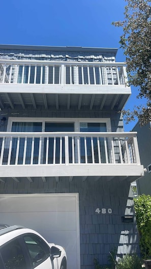 A two-story building with a white exterior, a garage, and a visible address number '480'. - 3 bedroom home - walk to Twin Lakes & Harbor! (Santa Cruz)