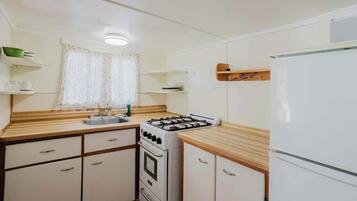 Fridge, microwave, stovetop, cookware/dishes/utensils