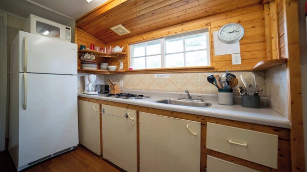 Fridge, microwave, stovetop, cookware/dishes/utensils