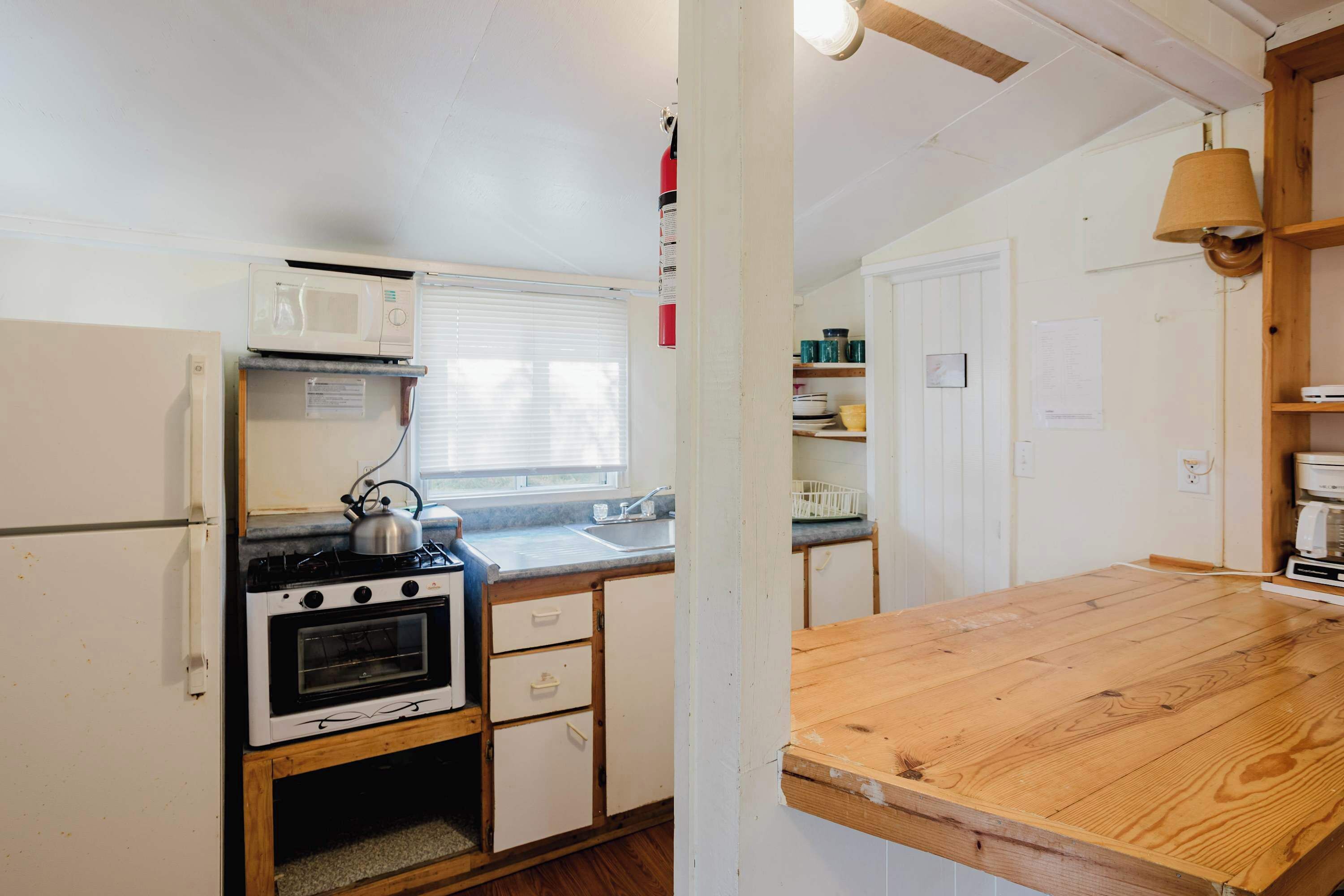 Fridge, microwave, stovetop, cookware/dishes/utensils