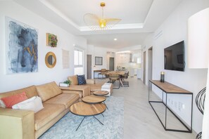 Luxury Suite, 3 Bedrooms, Beach View | Living area | 55-inch Smart TV with digital channels - Destination Jelly Playa Coral Condo (Punta Cana)