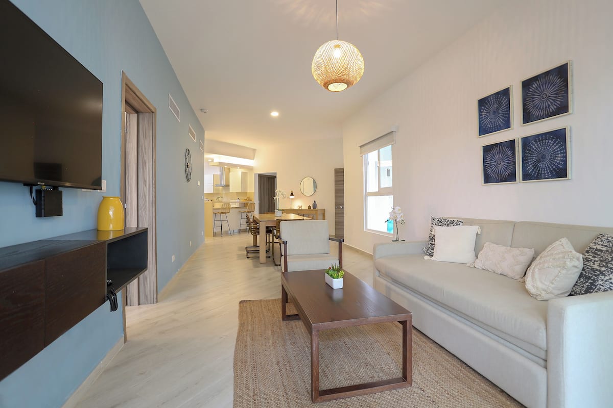 Premium Suite, 3 Bedrooms, Garden View, Ground Floor | Living area | 55-inch Smart TV with digital channels