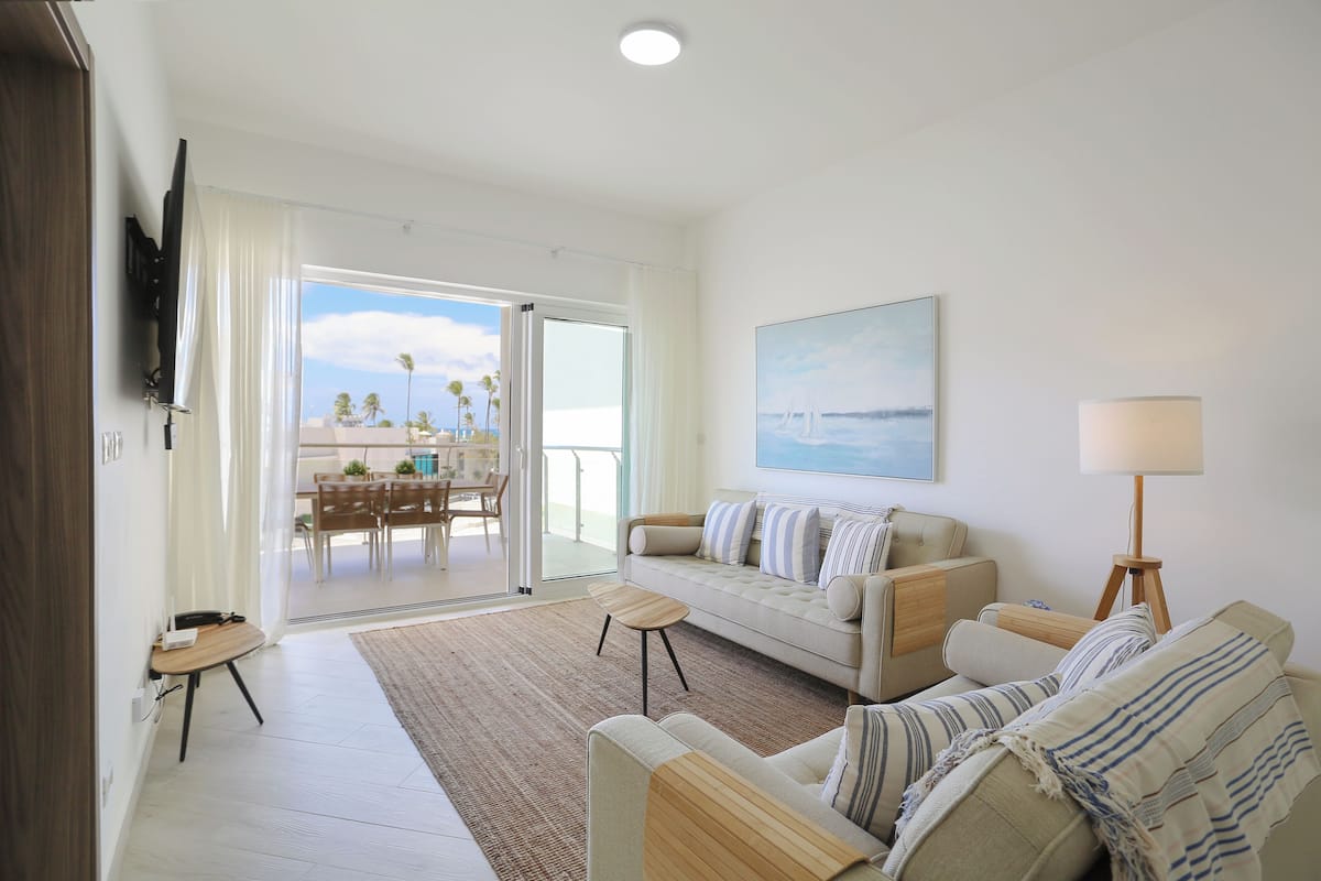 Premier Suite, 2 Bedrooms, Ocean View | Living area | 55-inch Smart TV with digital channels