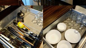 A kitchen with a Bosch toaster, a sink with various utensils, and a shelf with jars and kitchen items. - Stunning 1-bed Apartment in Bishop Auckland (Bishop Auckland)
