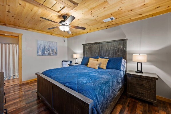 Your Bedroom Retreat and unwind in a rustic haven with a king-size bed, warm wood accents, and serene vibes!