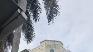 A multi-story hotel with a modern design, featuring a prominent 'HOTEL' sign on the facade. - Warisan Hotel (Kota Kinabalu)