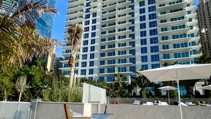 A high-rise hotel with a modern design, featuring balconies and a view of the surrounding cityscape. - Elite 2BR at La Vie with sea view (Dubai)