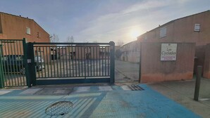 A gated entrance to a residential area with a sign reading 'Les Cyclades PROPRIETE PRIVEE.'