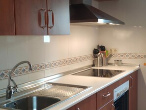 Microwave, oven, stovetop, dishwasher - Cozy 2-Bedroom Apartment with Sofa Bed Near Jaca - Sleeps 6 (Jaca)