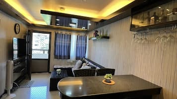 Family Condo, 2 Bedrooms, Pool View | Living area | Flat-screen TV