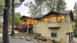 A two-story house with a front porch, a staircase, and a garage. - 3.3k Sqft, Arcade, Views, EV, Pinecrest & Dodge Ridge (Twain Harte)