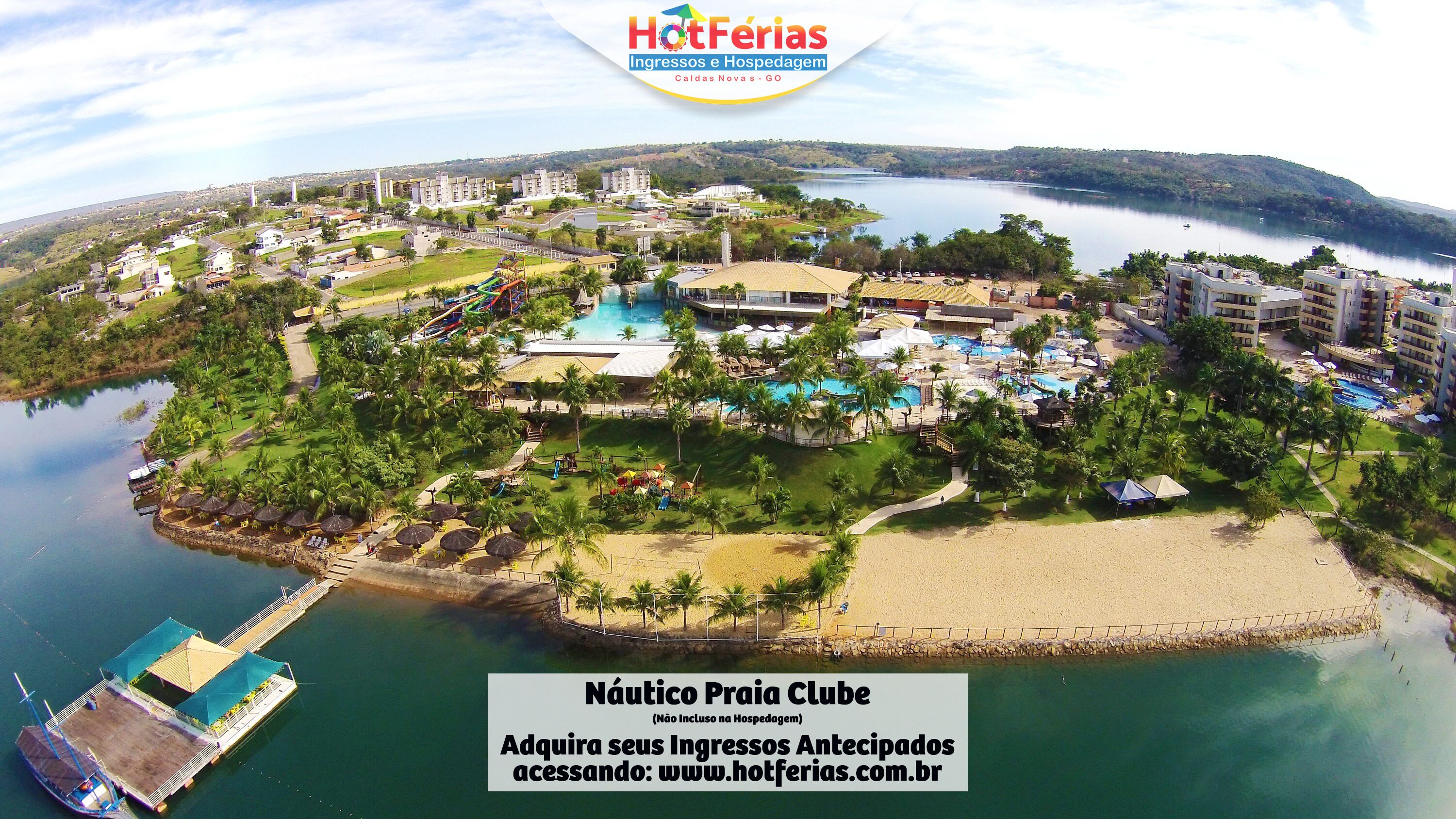 A resort with multiple swimming pools, a beach area, and a boat dock.