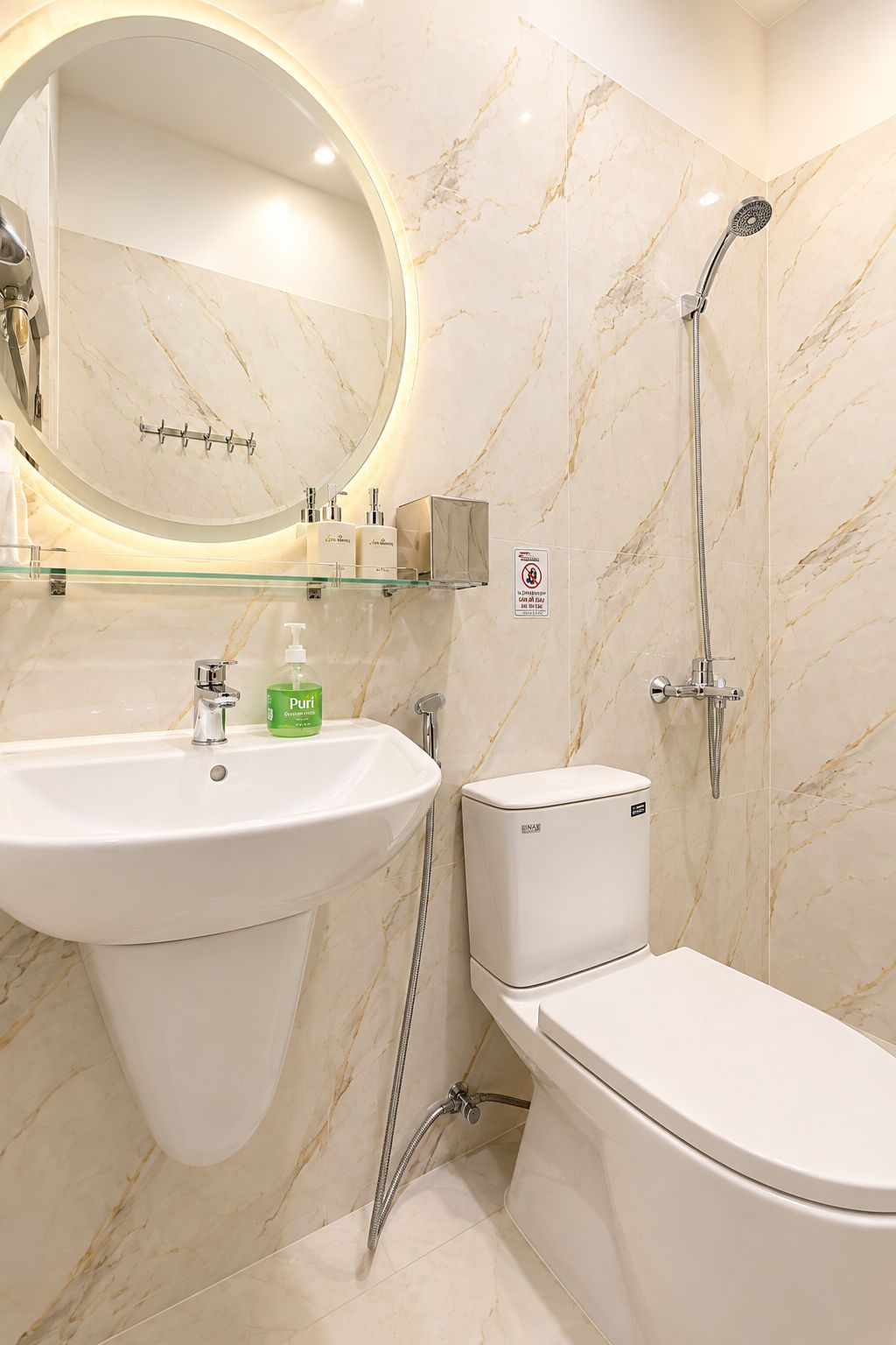 A bathroom with a sink, toilet, and shower.