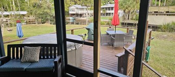 Cozy canal front house with its own boat ramp and dock. Amazing waterfront view.