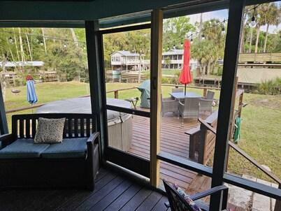 Cozy canal front house with its own boat ramp and dock. Amazing waterfront view.