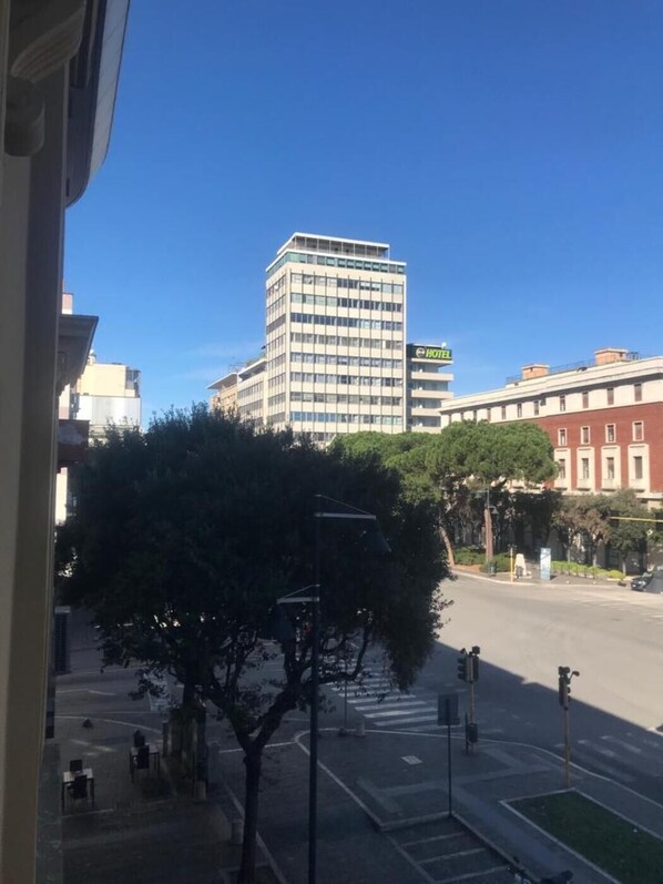 A hotel building with a sign that reads "HOTEL" on a clear day.