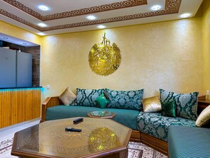 Comfort Apartment | Living area | 55-inch Smart TV with satellite channels - Luxurious Scandinavian-style pool & play (Oued Laou)