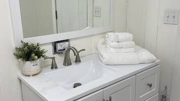 Hair dryer, towels, soap, shampoo