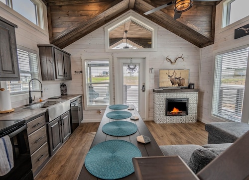 Escape to serene country living at Cow-zy Tiny Haus in Fredericksburg, TX