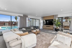 TV, fireplace - Sun Kissed Pool Villa - Mangawhai Holiday Home (Mangawhai)