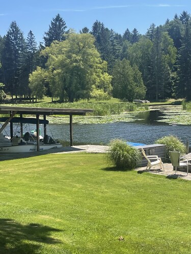 Cottage 4 is a charming 2  bedroom 25’ from your boat dock & Hamlin lake