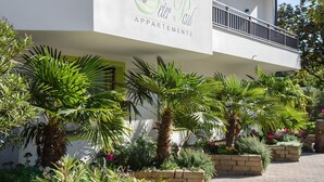 A building with a sign reading 'Peter Paul Apartments.'