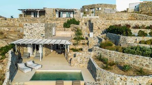 A stone villa with a pool, outdoor seating, and a covered patio. - Villa 'Vagia' with Private Pool, Private Terrace and Air Conditioning (S???f??)