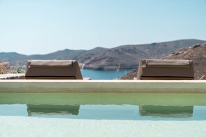 A pool with two lounge chairs facing a mountainous landscape. - Villa 'Vagia' with Private Pool, Private Terrace and Air Conditioning (S???f??)