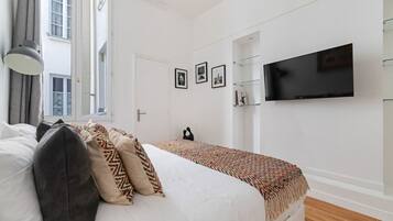 1 bedroom, desk, iron/ironing board, travel crib