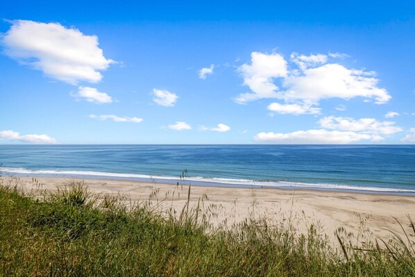A beach with a clear sky and ocean. - Full Ocean View-2 Decks-Heated Pool (Aptos)