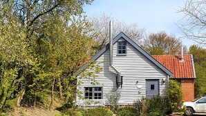 A white house with a red roof, surrounded by greenery and a paved driveway. - Twosome (Halesworth)